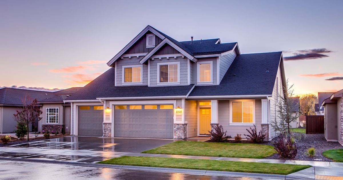 Two-story suburban house at dusk